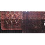 Antique Bokhara type rug with typical medallion decoration upon a brick red ground, 100 x 135 cm,