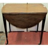 A Georgian mahogany and oak lined Pembroke table of oval form, raised on square tapered legs with