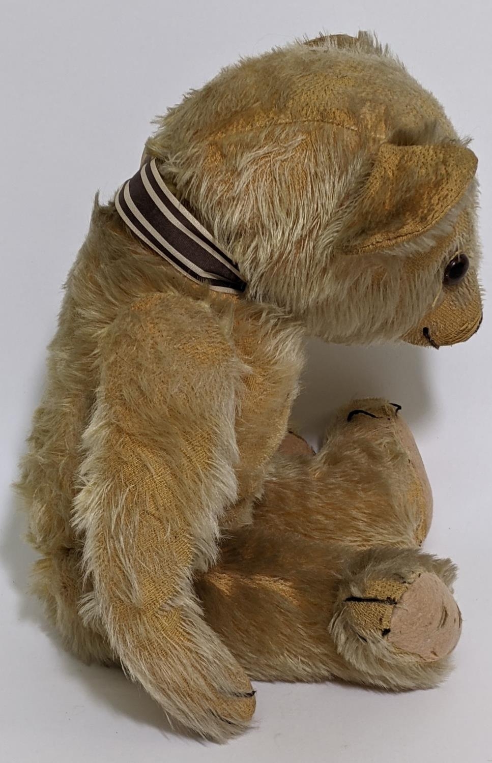 1930's teddy bear possibly by Merrythought with golden mohair, slight humped back, glass eyes, - Image 3 of 5