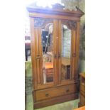 An Edwardian satin walnut bedroom pair comprising a wardrobe enclosed by a pair of three quarter