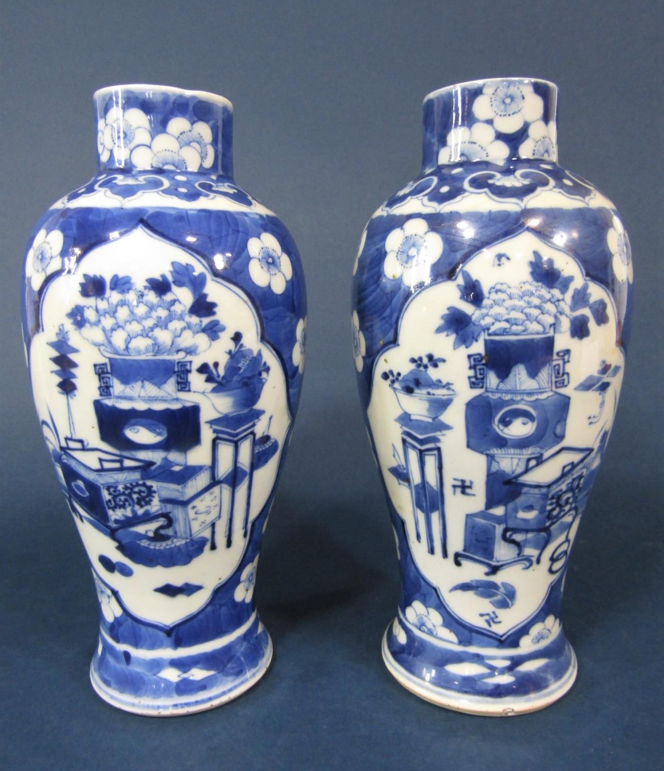A pair of 19th century Chinese blue and white vases of shouldered form with reserved painted - Image 2 of 3