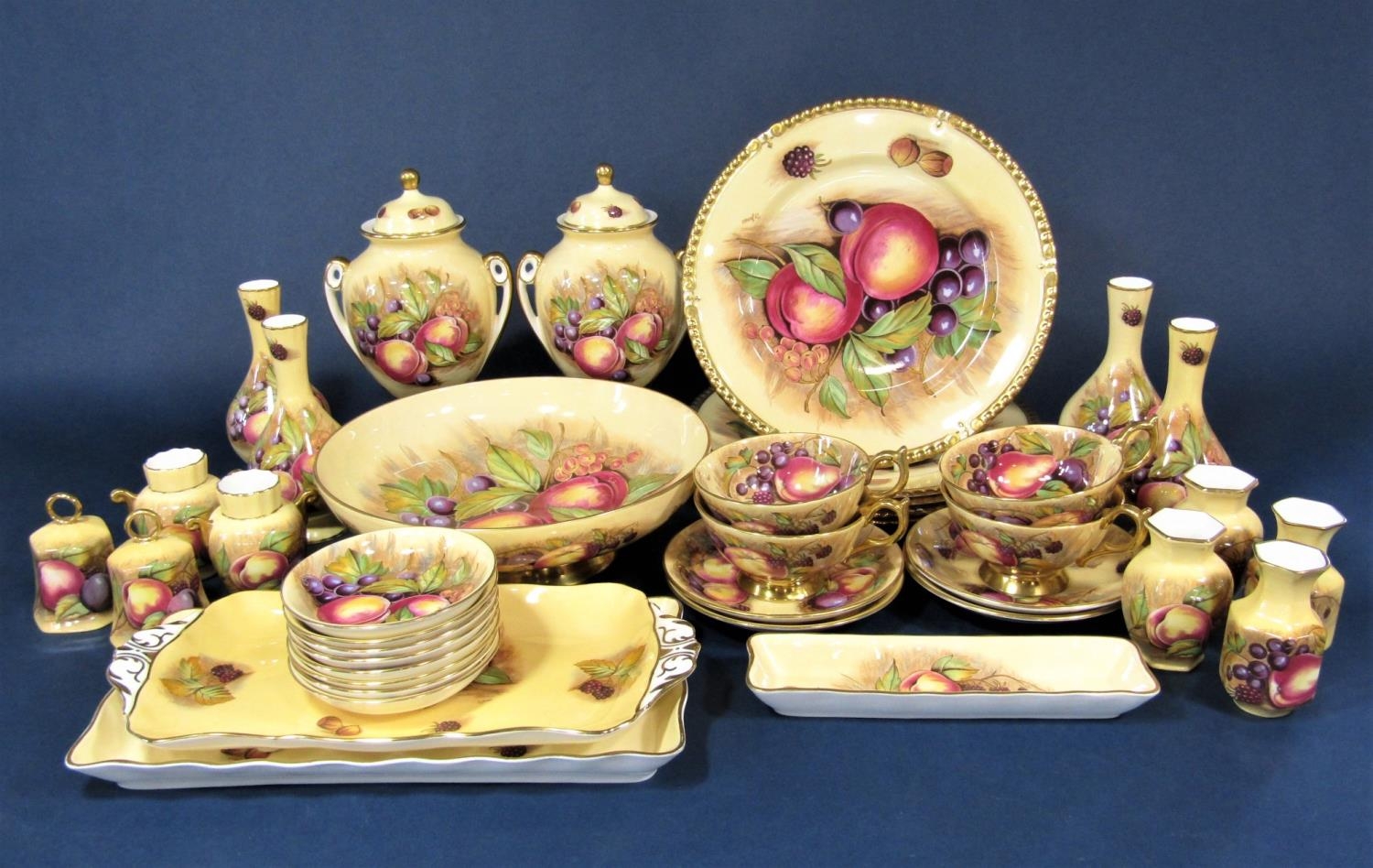 A collection of Aynsley fruit decorated wares by S Jones comprising a pair of two handled covered