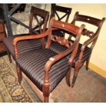 A pair of Regency mahogany elbow chairs with bulls eye splats together with a further pair of