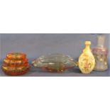 Three Whitefriars bubble glass orange bowl/ashtrays, the largest 16 cm diameter, together with a