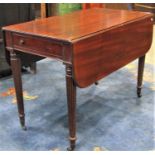 A 19th century mahogany Pembroke table fitted with the usual arrangement of one real and one dummy