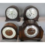 Three Smith two train vintage mantle clocks, one in bakelite together with a similar Enfield example