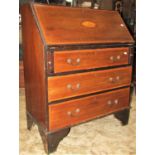 An inlaid Edwardian mahogany writing bureau with satinwood crossbanding and shell detail, the fall