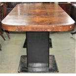 An Art Deco twin pedestal dining table, the rectangular top with curved ends and well matched