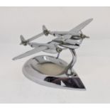 Trench Art Interest - A chromium desk top model of a P51 Lightening with ashtray base, 17cm wingspan