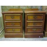 A pair of Georgian style low three drawer bedside chests with moulded plinths, 44 cm wide x 50 cm