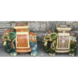 Two similar glazed ceramic garden/conservatory seats in form of elephants wearing ceremonial