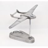 Trench Art Interest - A chrome desk top model of a Vampire Jet, with ashtray base, 17cm wide
