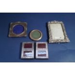 Five silver applied easel picture/photo frames, the largest 18 x 14 cm (5)