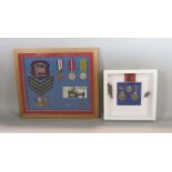 A framed collage of the 1964 Winter Olympics, WWII medals, shrapnel, military pips, etc