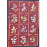 Needlepoint panel 130 x 88cm with burgundy ground divided into 12 areas each depicting a design of