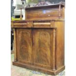 A Regency mahogany chiffonier, the base enclosed by a pair of arched and panelled doors, with column