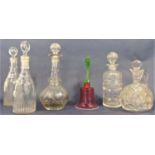 Pair of faceted tapered cut glass decanters with stoppers, 29 cm high, together with two others, a
