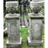 A pair of small reclaimed classical style circular planters with repeating Greek key and fruiting