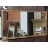 A rectangular gilt framed wall mirror with moulded frame and beaded slip, 128cm x 67cm