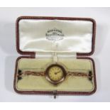 1920s ladies 9ct cocktail watch, with circular case, gilt dial with Arabic numerals, 24mm case, upon
