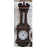 A substantial late Victorian oak barometer, the casework of architectural form with reeded column