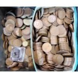 An old biscuit tin containing an unsorted collection of bronze coinage, George V and later (