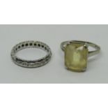 18ct citrine dress ring, size N, 3.7g and a 9ct white gold diamond eternity ring, size K/L, 2.6g (2)