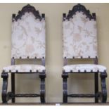 A set of five of 19th century European carved walnut side chairs raised on pronounced S shaped