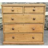 An old rustic reclaimed stripped pine bedroom chest of two short over three long drawers set/