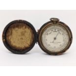 A Negretti and Zambra pocket barometer in metal case diameter 4.5 cm, in fitted leather case