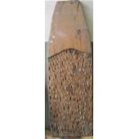 An old agricultural pine threshing board with tapered end and inset shards of flint, 56 cm wide x