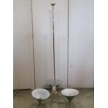 A three branch tubular brass effect hanging ceiling light with tall stem and moulded green glass