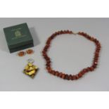Pair of 14ct cabochon amber earrings in House of Amber Copenhagen box, together with a graduated