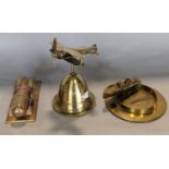 Trench Art Interest - An artificer-art bell metal model of a bomb resting on a cradle, a hand bell