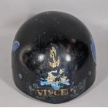 A vintage motorcycle helmet with transfers for Vincent and Triumph motorcycles