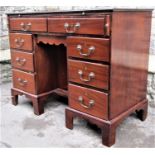 19th century mahogany kneehole writing desk/gentlemans valet fitted with an arrangement of nine