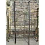 A Victorian brass and iron bedstead with square bars and turned rails, 140cm wide (af)