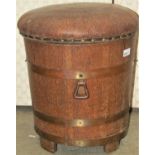 A Lister coopered oak and brass banded cylindrical coal bin with removable liner and rexine