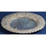 Eastern fine silver oval dish with wavy rim embossed with birds amidst foliage inscribed Chiangmai