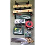 A Bosch PSR18 vault cased battery drill, Bosch PSA700E electronic electric hand saw, a Bosch IXO tin