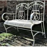 A contemporary cream painted light steel framed two seat garden bench with scrolled lyre shaped twin