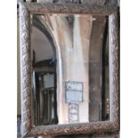 A large contemporary wall mirror of rectangular form with bevelled edge plate within a moulded