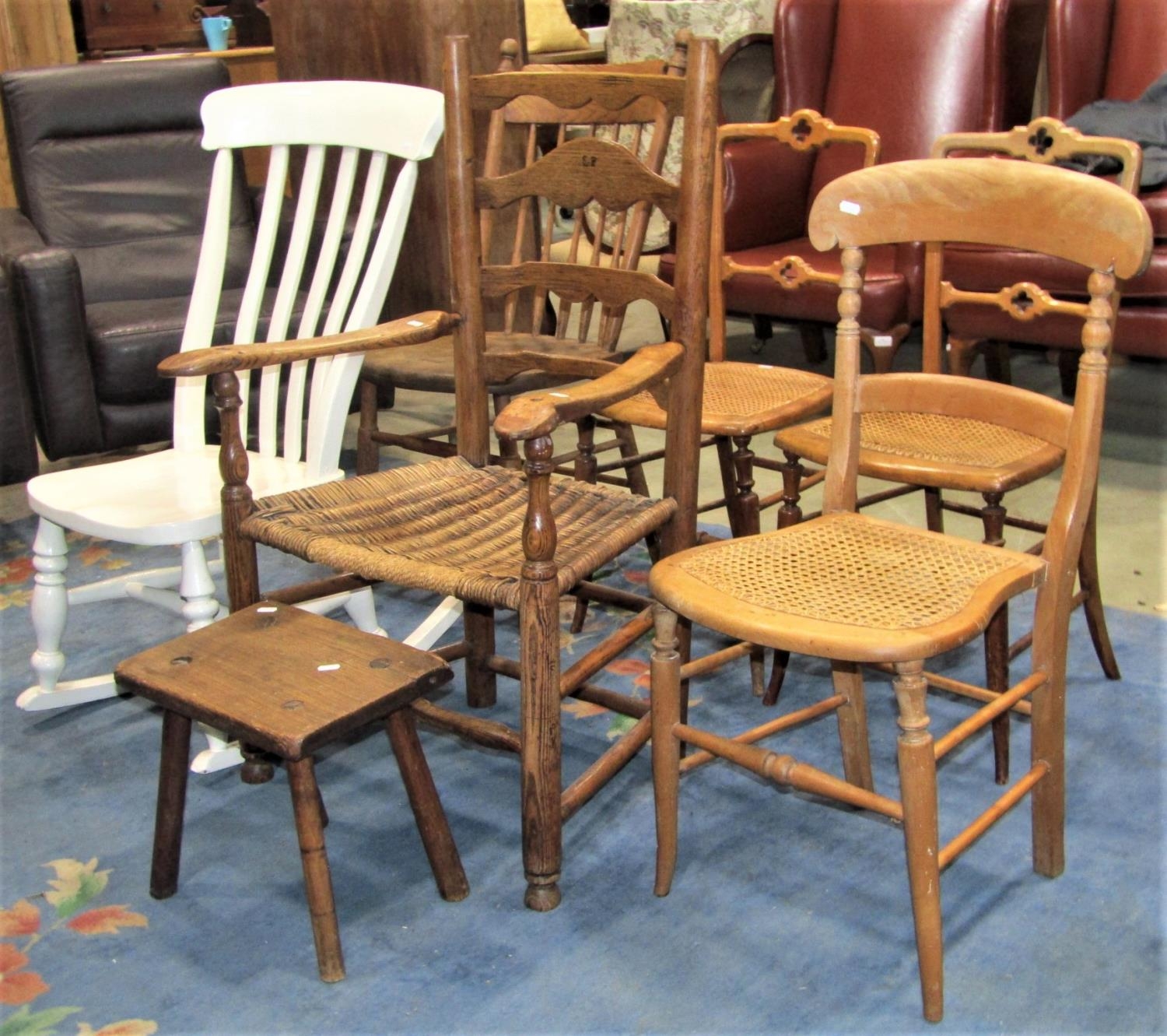 A set of three 19th century Windsor moulded bar back kitchen chairs with turned top rails,