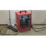 A fine elements 3kw utility heater (used) but in original cardboard packaging, together with an