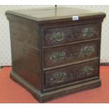 A small Georgian oak countrymade chest of three drawers with repeating carved detail on bracket