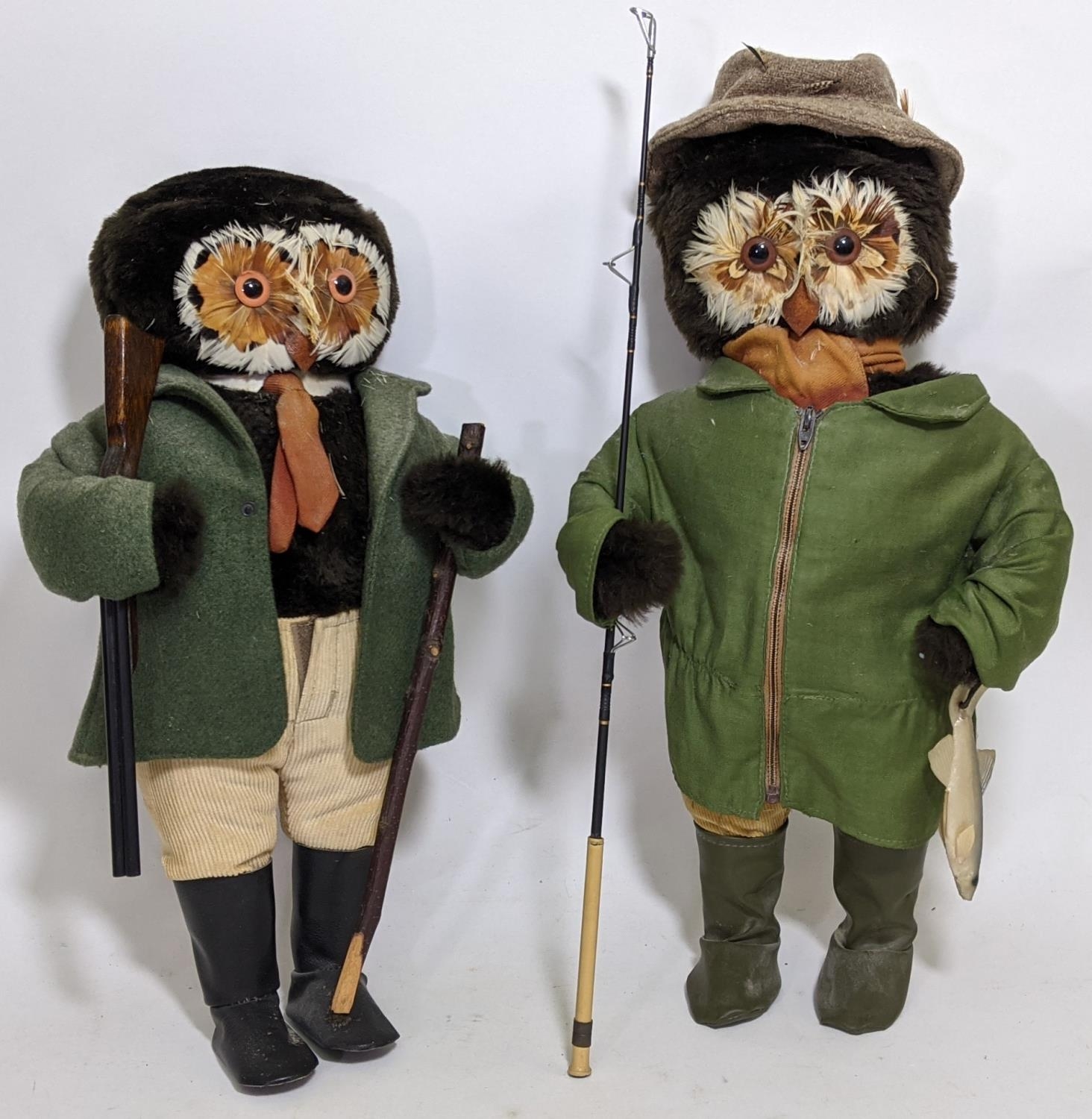 A pair of character soft toy standing figures with feathery owl faces, both dressed for country