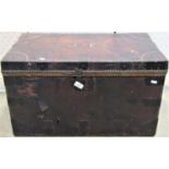 A 19th century wooden leather clad and steel banded trunk with side carrying handles and steel