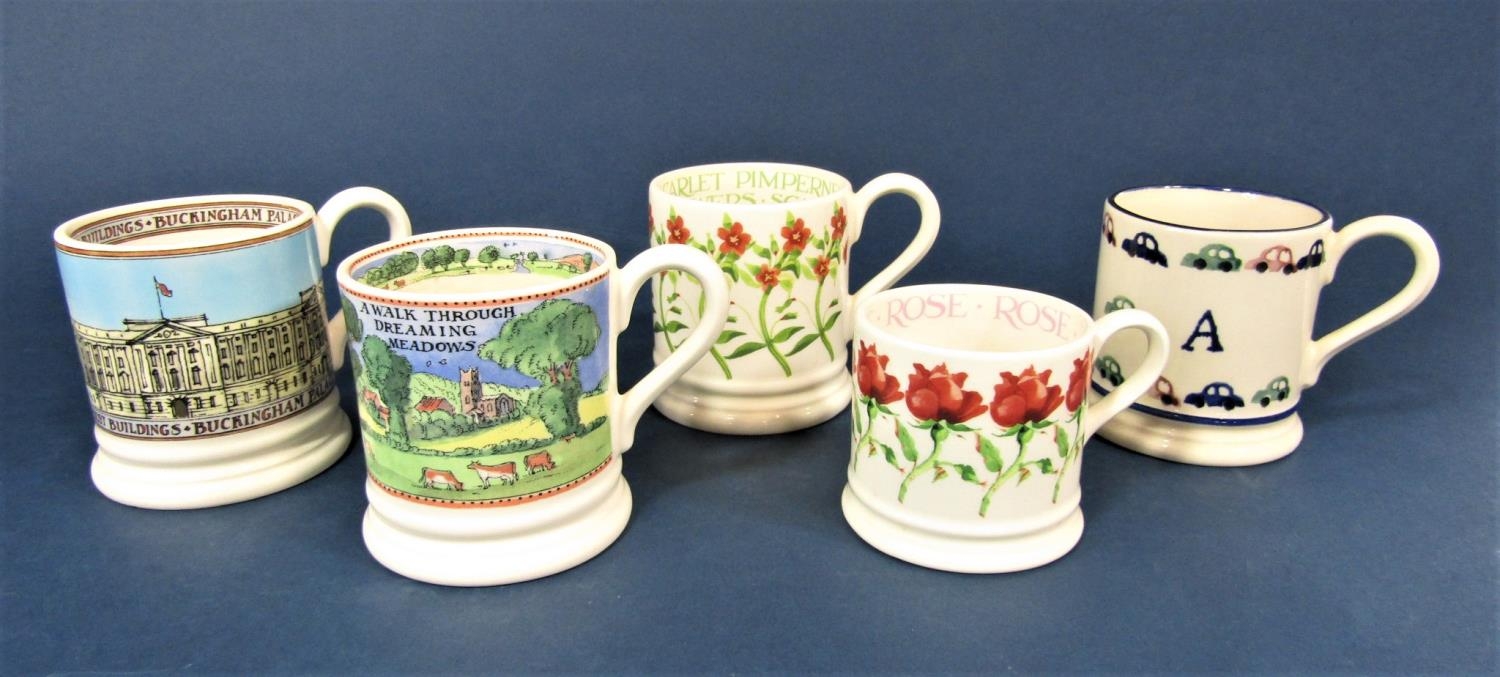 A collection of five Emma Bridgewater mugs including a child's mug with the initial A and car