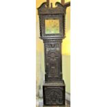 A 19th century oak longcase clock, the case profusely carved depicting a lion, eagle, cherubs,