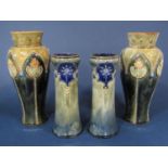 A pair of Royal Doulton vases of shouldered form with relief moulded and painted stylised organic
